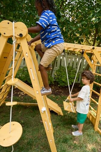 Children playing on a wooden outdoor climber.