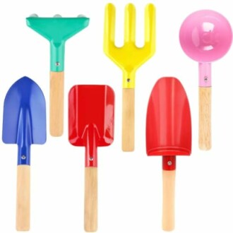 Set of colorful kids gardening tools with wooden handles.