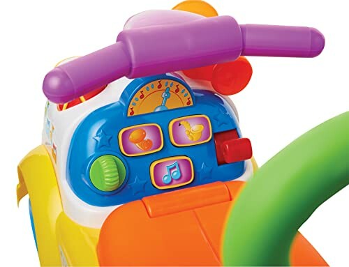 Close-up of a colorful toy dashboard with buttons and dials.