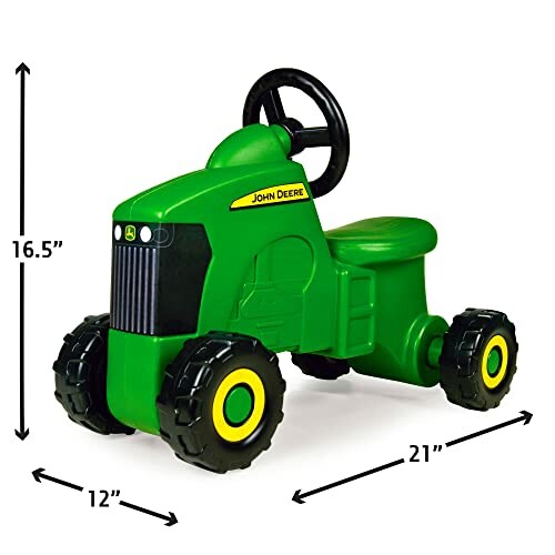 Green ride-on toy tractor with black wheels and steering wheel