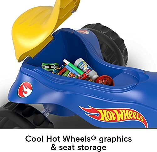 Hot Wheels ride-on toy with seat storage compartment open.