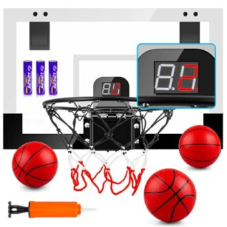 Indoor basketball hoop set with digital scoreboard, balls, and pump.