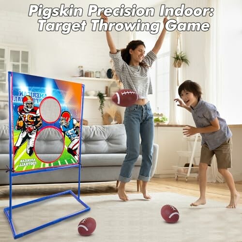 Mother and son playing indoor target football throwing game.