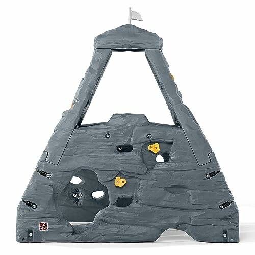 Children's climbing wall with rock-like design and grips