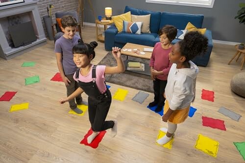 Children playing an indoor game with colored mats.