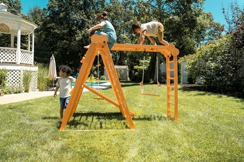 Children playing on a wooden swing set in a backyard.