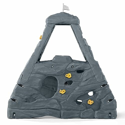 Gray triangular kids rock climbing wall with yellow holds and flag.