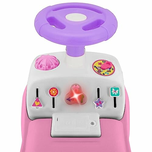 Pink toy car dashboard with purple steering wheel and colorful buttons.