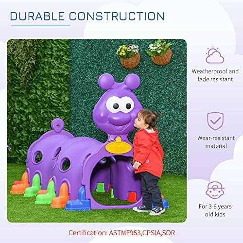 Child playing with a purple caterpillar-shaped play tunnel outdoors.