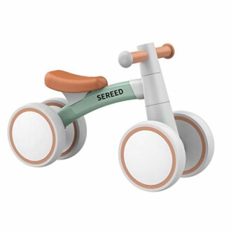 Toddler balance bike with four wheels and no pedals.