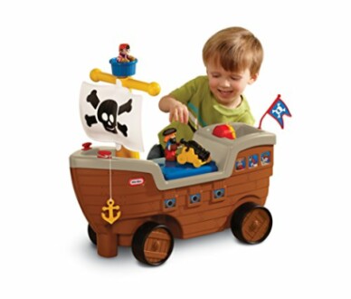 Child playing with a pirate ship toy.