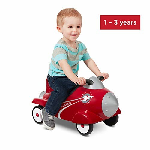 Toddler riding a red airplane toy for ages 1 to 3 years.