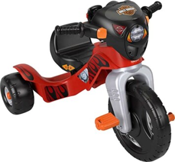 Red and black toddler ride-on toy motorcycle with flame design.