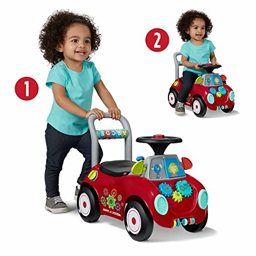 Toddler playing with a red ride-on toy car.