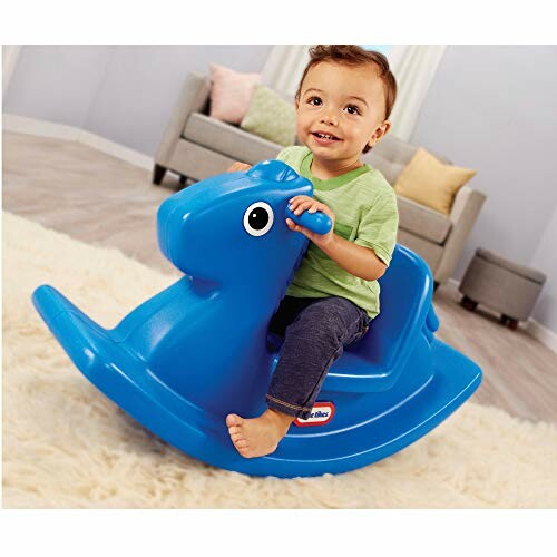 Toddler riding a blue plastic rocking horse indoors.
