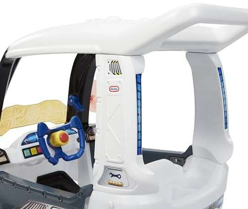 Interior of a toy car with steering wheel and dashboard