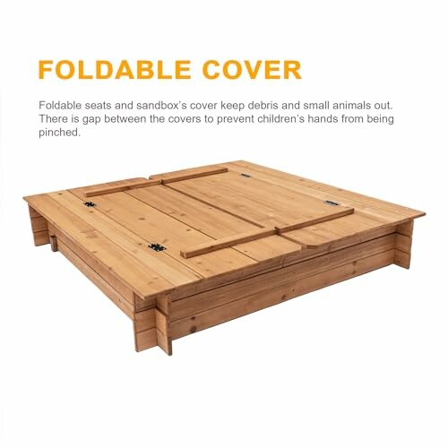 Wooden sandbox with foldable cover.